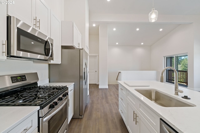 kitchen with sink, white cabinetry, and stainless steel appliances