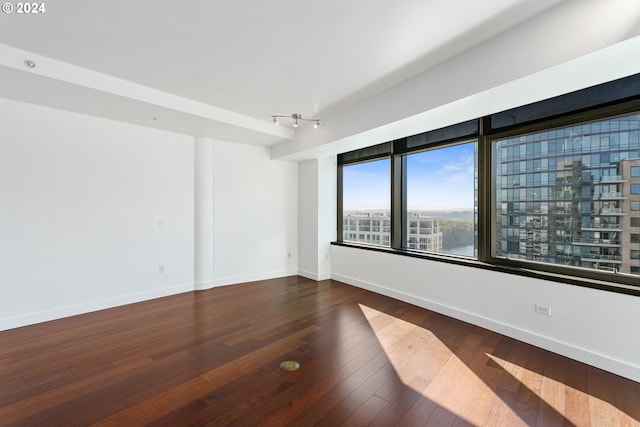 unfurnished room featuring hardwood / wood-style floors