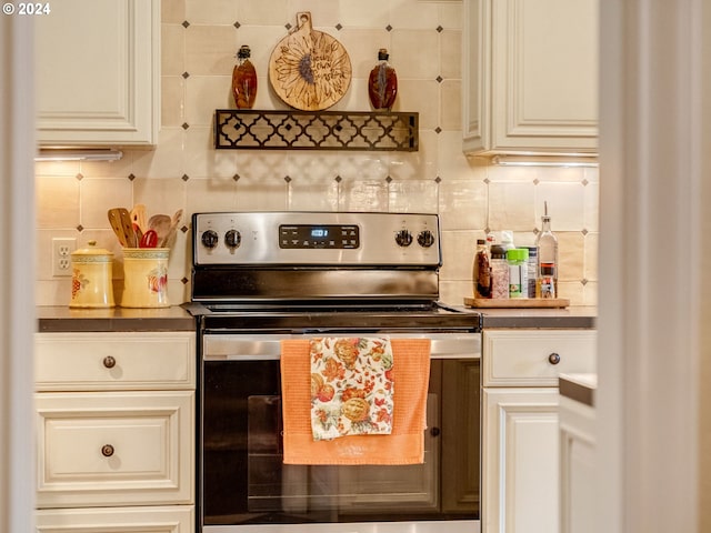 71465 Northshore Dr, Birkenfeld, OR 97016 - kitchen with electric range, backsplash, and dark countertops