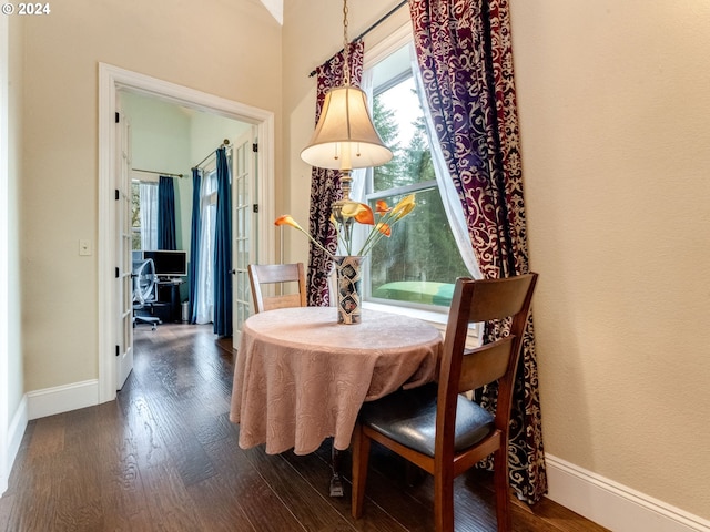 dining space featuring dark hardwood / wood-style floors