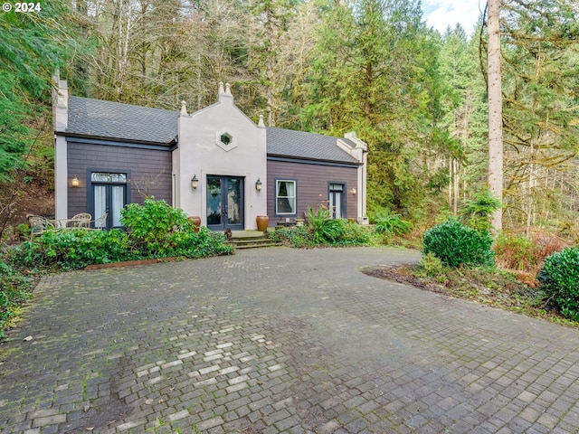 71465 Northshore Dr, Birkenfeld, OR 97016 - view of front of home with french doors and a chimney