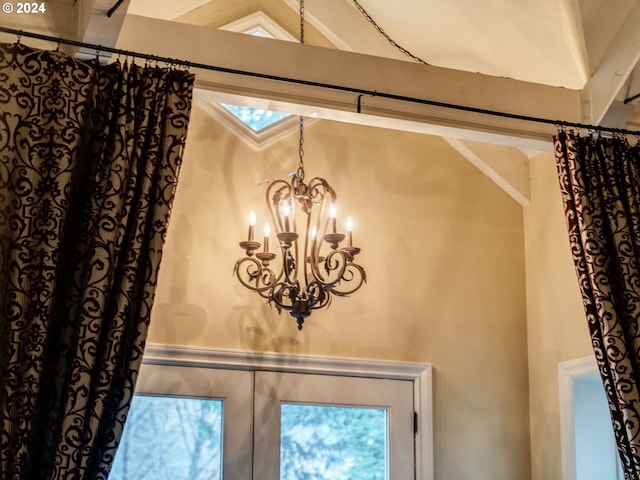 room details with an inviting chandelier and french doors