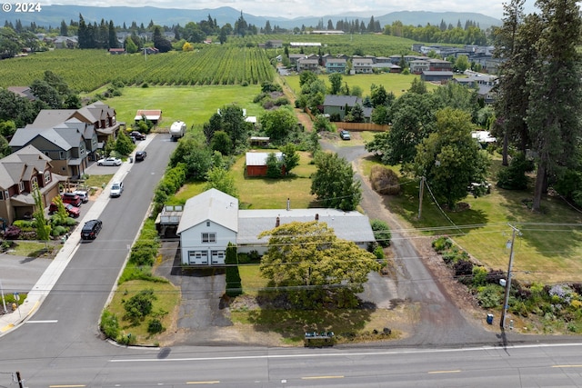 birds eye view of property with a mountain view