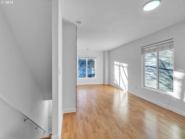 unfurnished room with light hardwood / wood-style flooring