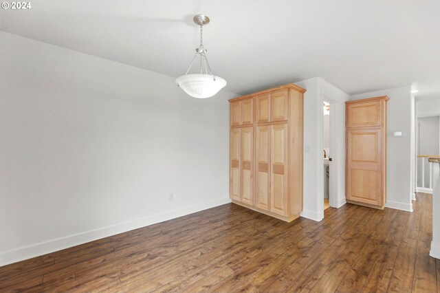 unfurnished dining area with wood-type flooring