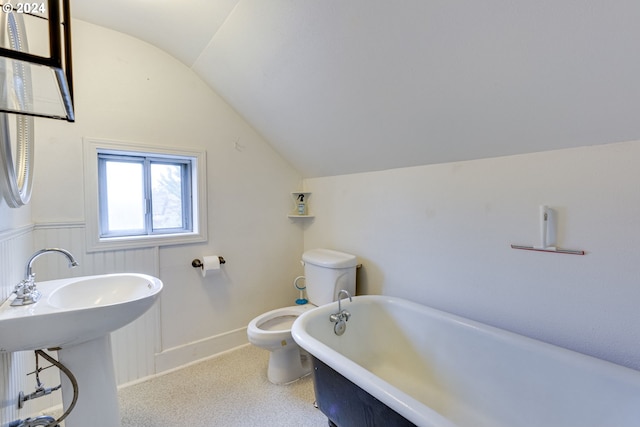 bathroom featuring lofted ceiling, sink, a washtub, and toilet