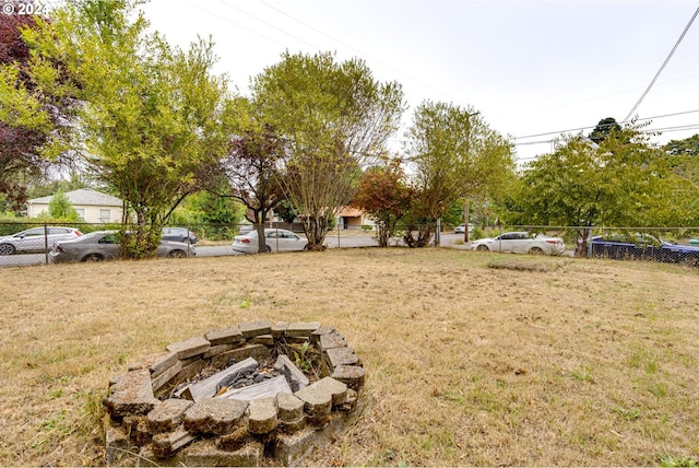 view of yard with a fire pit