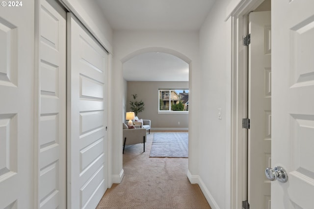 hallway with light carpet