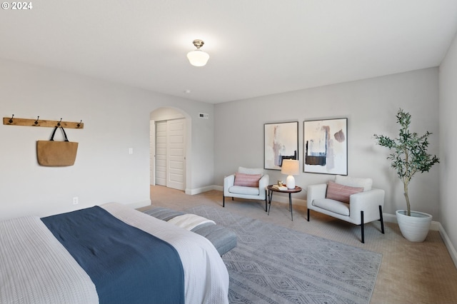 bedroom with light colored carpet