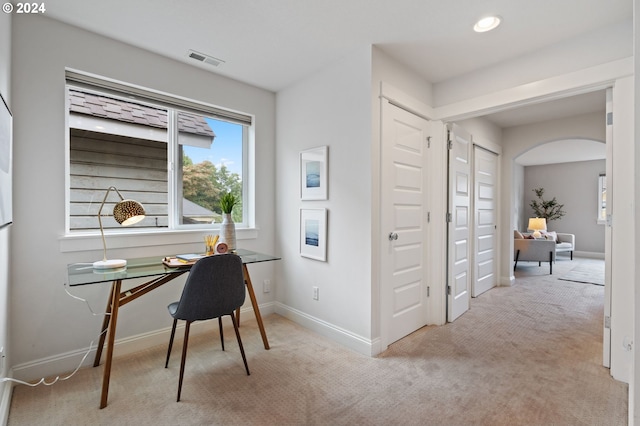 office space with light colored carpet