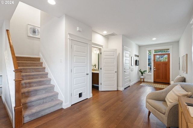 foyer entrance featuring dark hardwood / wood-style floors