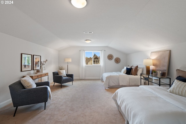 carpeted bedroom featuring vaulted ceiling