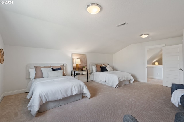 bedroom with light carpet and lofted ceiling