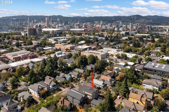 drone / aerial view featuring a mountain view