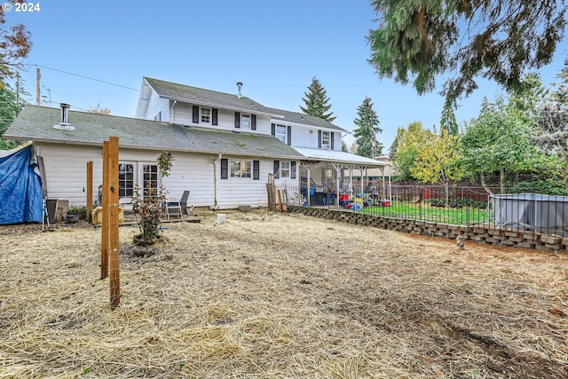 back of property featuring fence, a patio area, and french doors