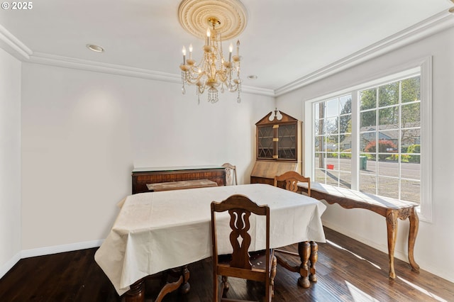 dining room with crown molding, wood finished floors, baseboards, a notable chandelier, and recessed lighting