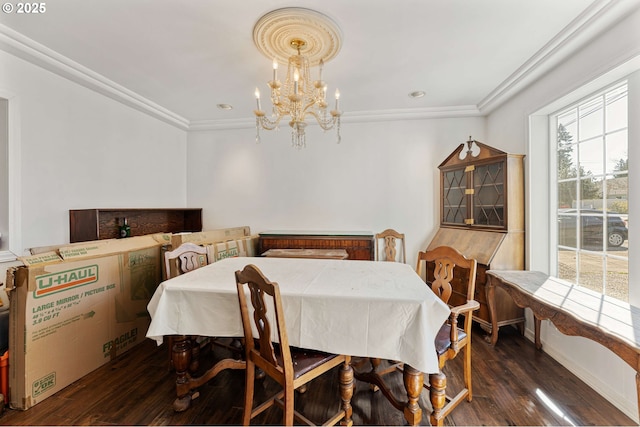 dining room featuring recessed lighting, wood finished floors, ornamental molding, and an inviting chandelier