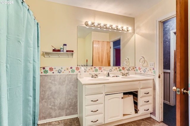 bathroom with vanity and tile patterned flooring