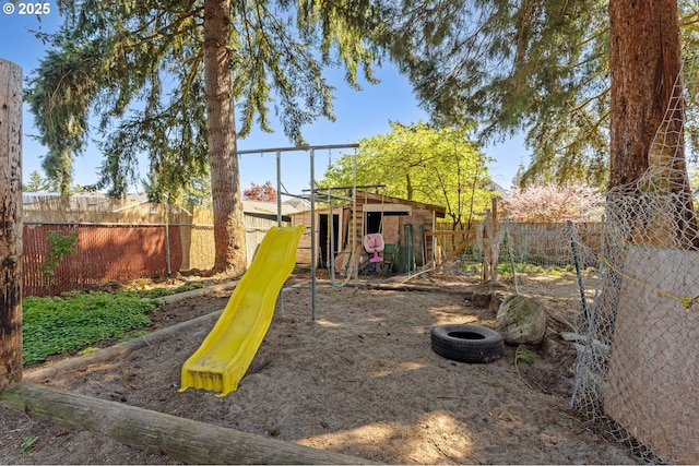 view of jungle gym with a fenced backyard