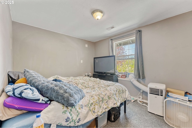 carpeted bedroom with baseboards and visible vents