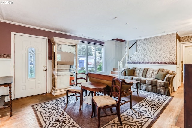 living room featuring hardwood / wood-style floors and ornamental molding