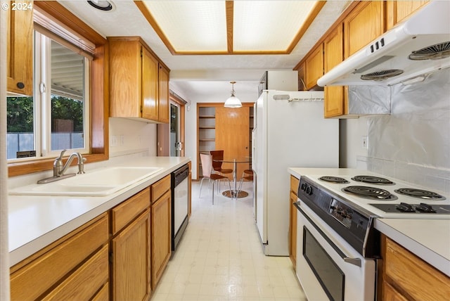 kitchen featuring white electric stove, dishwasher, hanging light fixtures, and sink