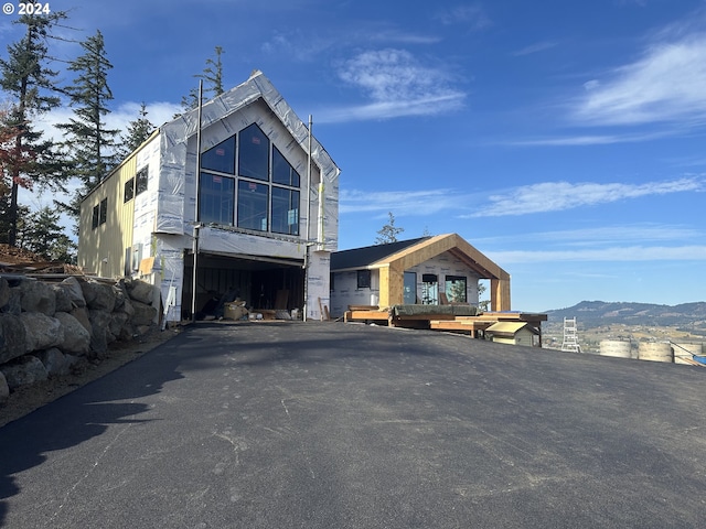 view of front of property with a mountain view