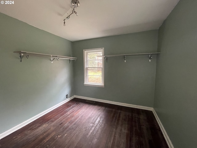 spare room featuring dark hardwood / wood-style flooring