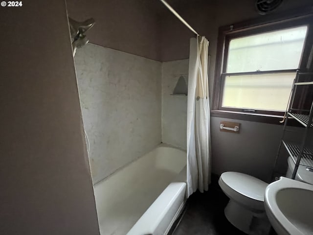 full bathroom with toilet, sink, and shower / tub combo with curtain