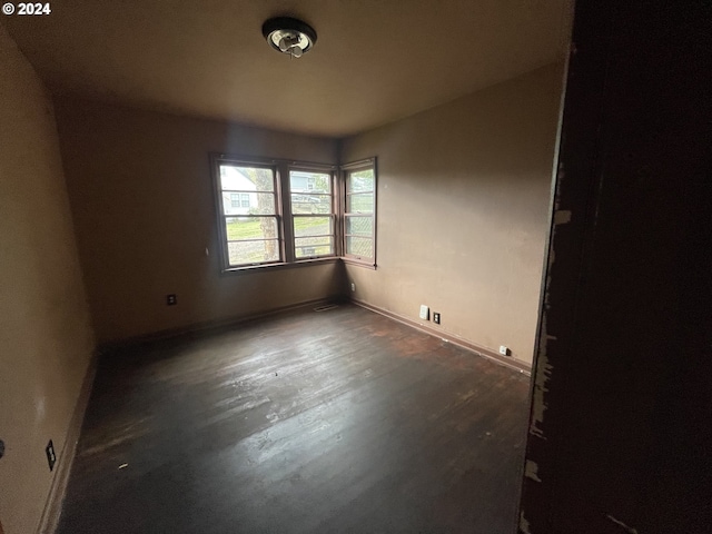 empty room featuring dark hardwood / wood-style floors