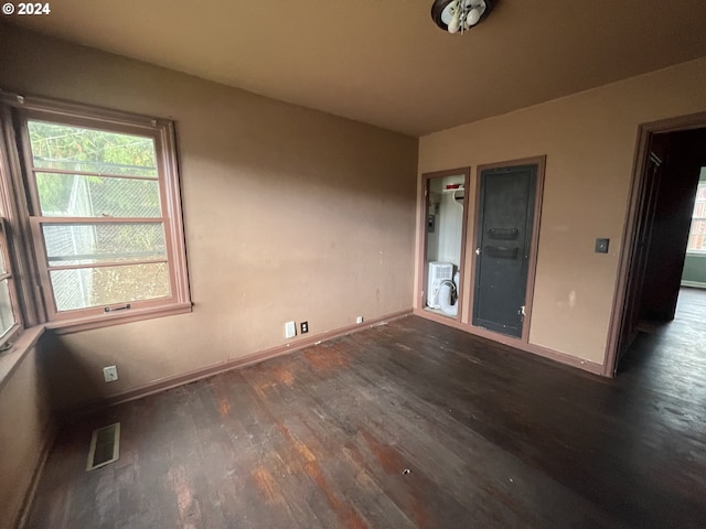 spare room featuring dark hardwood / wood-style floors