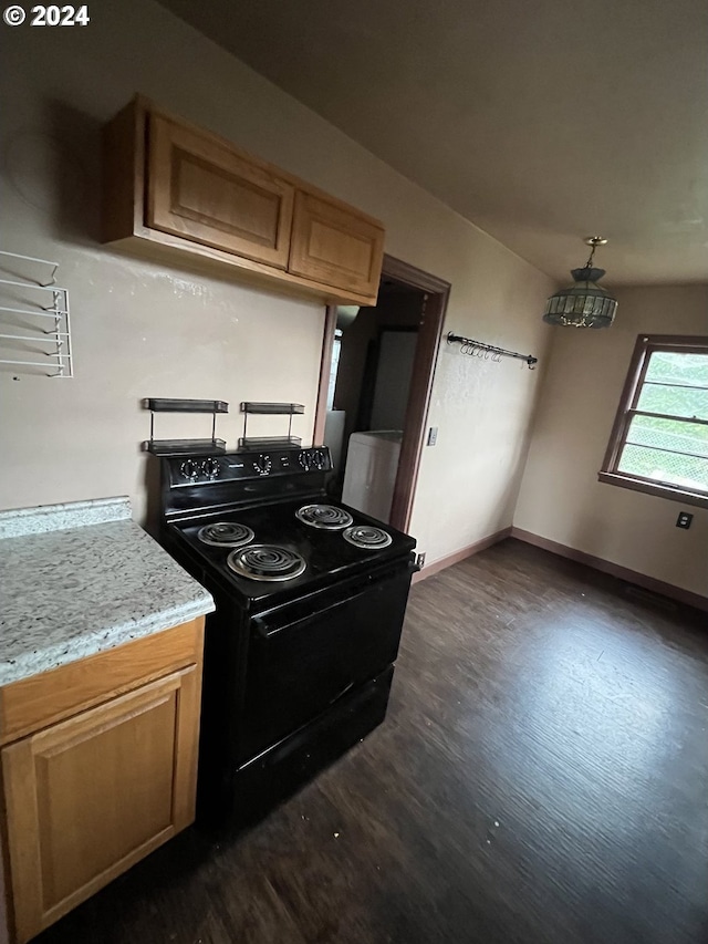 kitchen featuring dark hardwood / wood-style flooring and black electric range