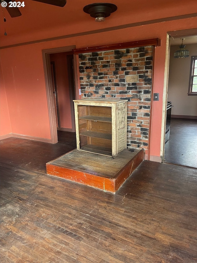 room details with hardwood / wood-style floors and range