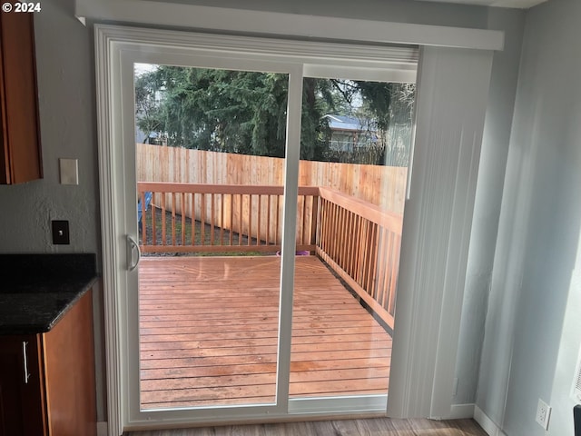 doorway to outside with light hardwood / wood-style flooring