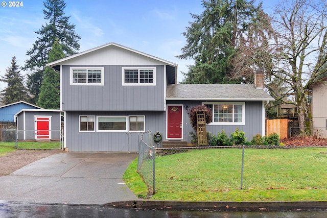 tri-level home with a front yard