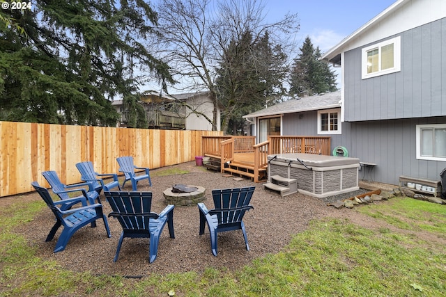 view of yard with a fire pit and a deck