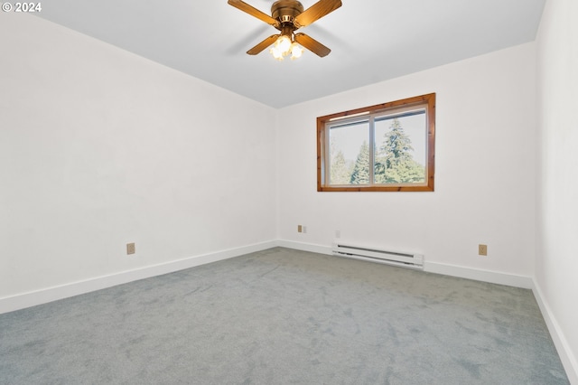 spare room featuring a baseboard heating unit, light colored carpet, and ceiling fan