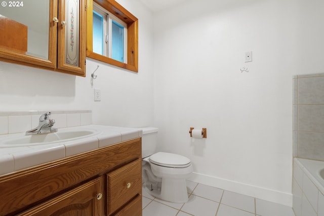 full bathroom featuring vanity, shower with separate bathtub, toilet, and tile patterned flooring