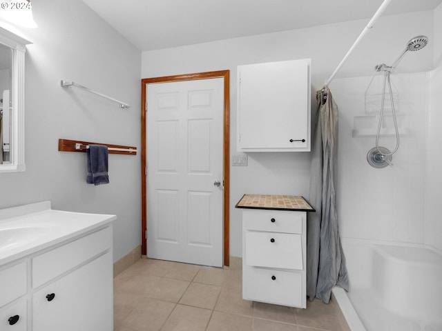 bathroom featuring tile flooring and vanity