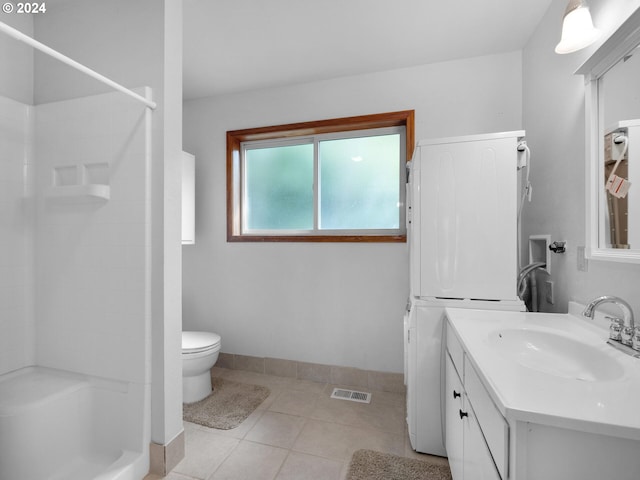 bathroom featuring vanity, toilet, and tile floors