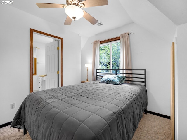 bedroom with ceiling fan, vaulted ceiling, and light colored carpet