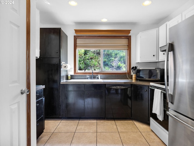 kitchen with sink, white cabinetry, black appliances, and light tile flooring