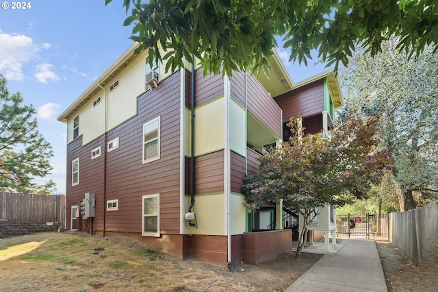 view of property exterior featuring fence