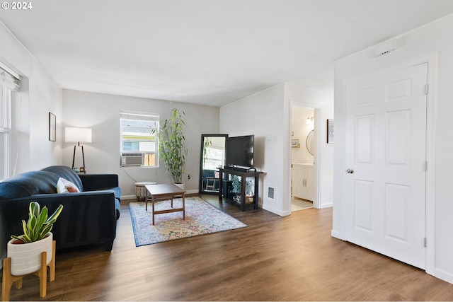 living room with dark wood-type flooring and cooling unit