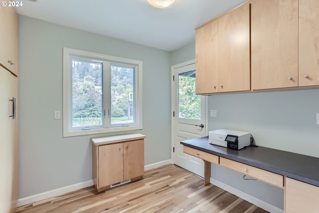 interior space with light brown cabinets and light wood-type flooring