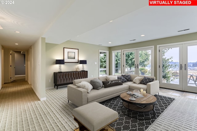 carpeted living room featuring french doors