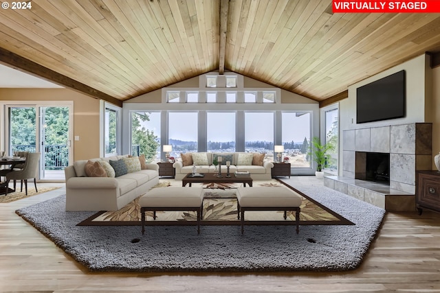 living room featuring a tile fireplace, wooden ceiling, lofted ceiling with beams, and hardwood / wood-style flooring