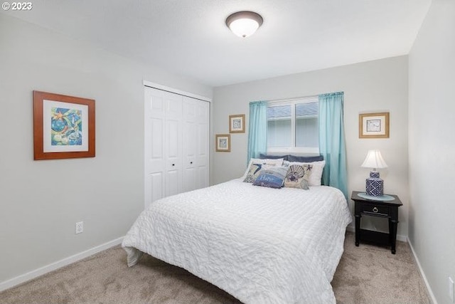 carpeted bedroom featuring a closet