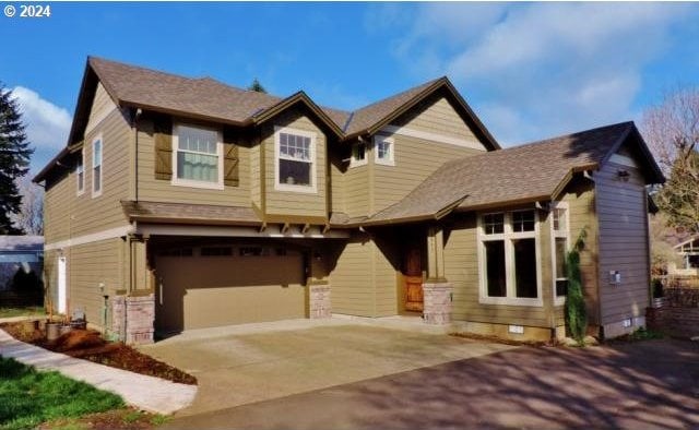 craftsman-style home featuring a garage