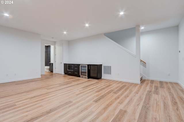 unfurnished living room featuring light wood-style flooring, recessed lighting, visible vents, and baseboards